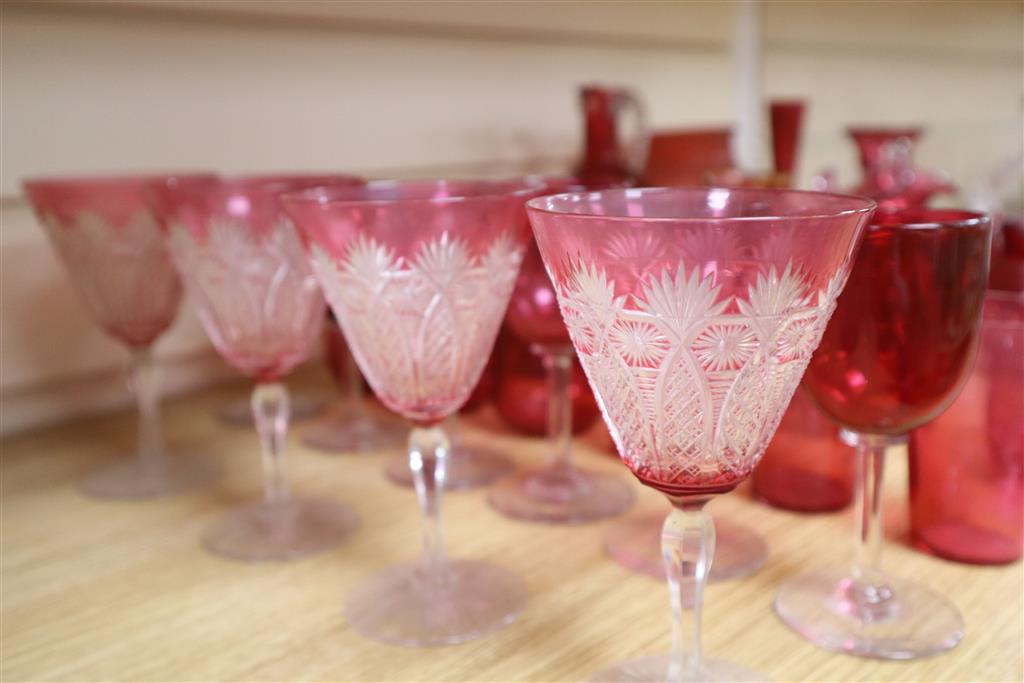 A collection of Victorian and later cranberry and ruby coloured glassware, ewer 18cm